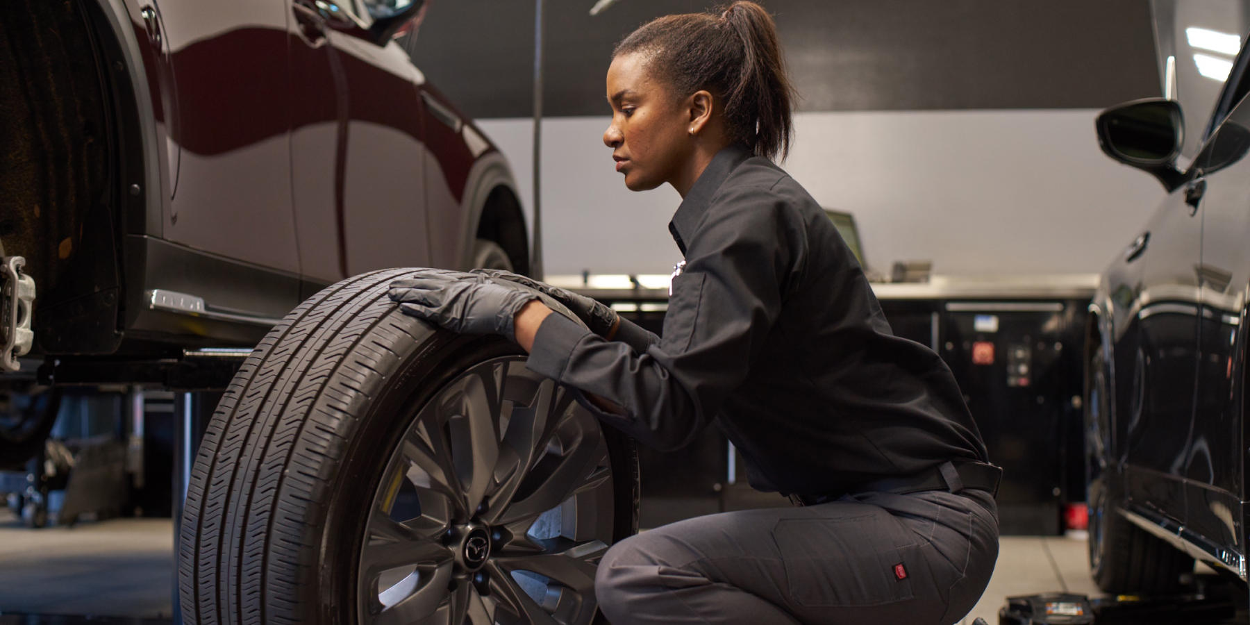 Automotive Technician replacing tire Automotive Technician replacing tire